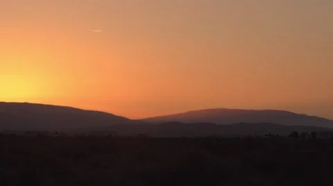 Contrails over the desert at sunset Stock Footage 49044093