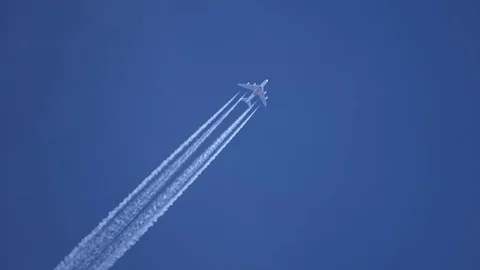 Contrails in the sky, Four-jet jet aircraft, 4K Stock Footage 76117437