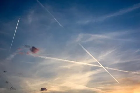 Contrails at Sunset Stock Photos