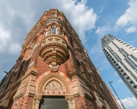 Contrast between an old and a modern building Stock Photos