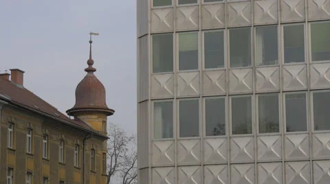 Contrast between an old and a new building in Ljubljana Stock Footage 61398329