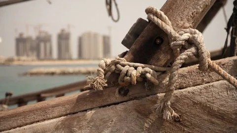 Contrast between old ship and new construction on the coast Stock Footage 74171051