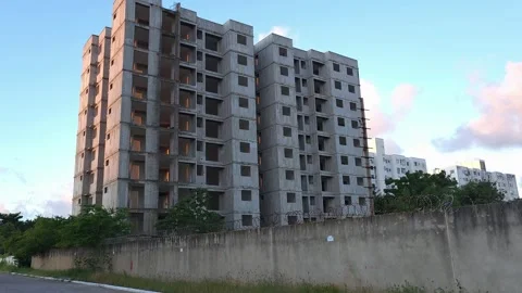 Contrast Between Unfinished Building and Occupied Residential Tower. Stock Footage 326563354
