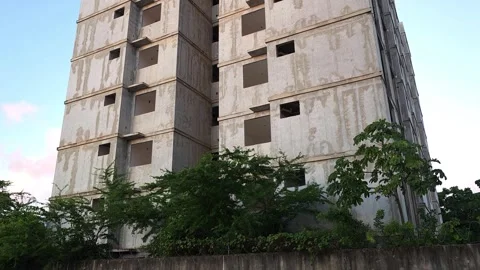 Contrast Between Unfinished Building and Occupied Residential Tower. Stock Footage 326563373