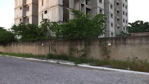 Contrast Between Unfinished Building and Occupied Residential Tower. Stock Footage 326563374