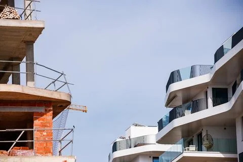 Contrast of Construction and Completion Stock Photos