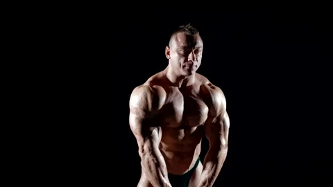 The contrast of light and shadow highlights the volume and symmetry of a bodybui 스톡 동영상 300887483