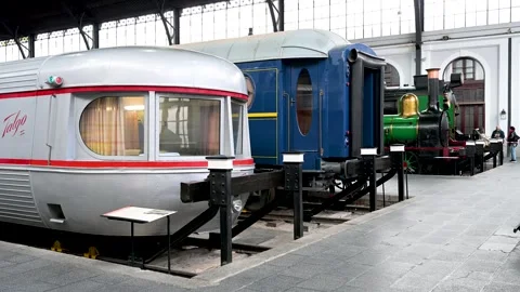 A contrast of train technology eras at Madrid's Railway Museum: Talgo, coach &amp; Stock Footage 310371526