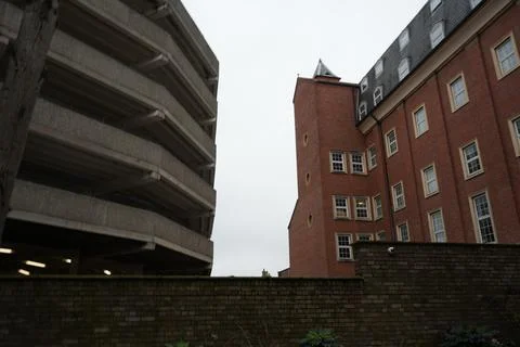 Contrasting Architecture In Nottingham England: Brutalist Car Park And Brick Stock Photos