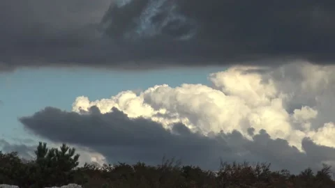 Contrasting dark and light clouds timelapse Stock Footage 159075530