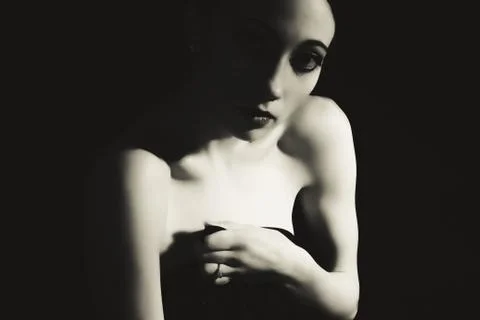 Contrasting dramatic black and white portrait of a young woman Stock Photos