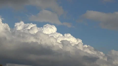 Contrasting light and dark clouds timelapse Stock Footage 159075742