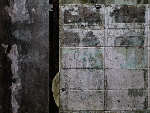 Contrasting Textures of Rusty Metal Panel and Stained Concrete Wall Stock Photos