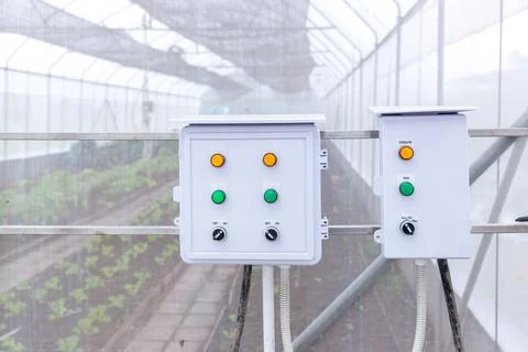 	Control box water timer in organic farm at greenhouse. Stock Photos