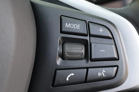 Control button on steering wheel closeup Stock Photos