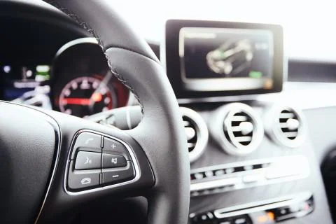Control buttons on steering wheel. Car interior. Stock-Fotos
