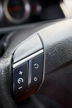 Control buttons on steering wheel. Car SUV interior. Car detail, cruise con.. Stock Photos