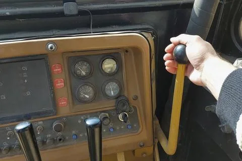 Control cabin of the pipelayer, the gearbox and control levers of the unit .. Stock Photos