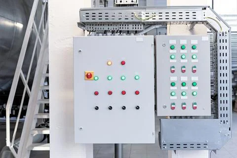 Control cabinet with buttons and toggle switches in a gas boiler room. Stock Photos