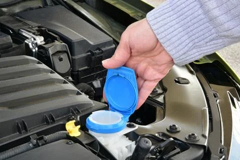 Control of car windshield washer fluid Stock Photos