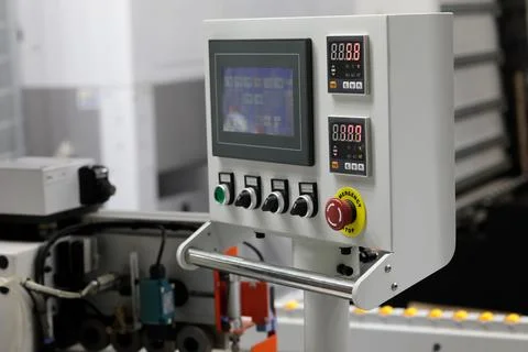 Control console of automatic edge banding machine Stock Photos