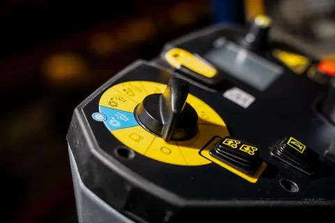 Control console of industrial machine in yellow colored panel Stock Photos