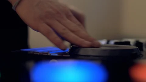 Control the DJ console at a nightclub. Stock Footage 102235463
