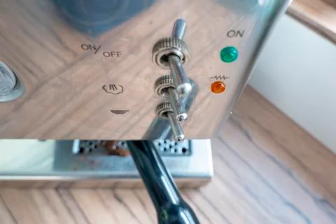 Control elements of a silver espresso screen carrier machine Stock Photos