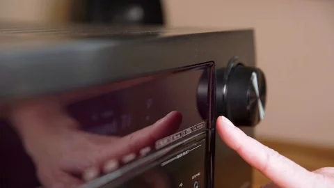 Control the function on the black amplifier using the buttons and the scroll Video stock 121769648