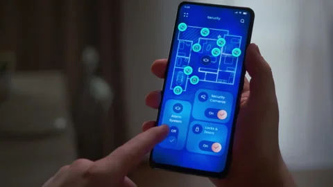 Control home security with a phone app: locks, alarm, cameras Stock Footage 318429669