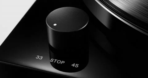 Control knob on turntable with spinning vinyl record on Stock-Footage 155857582