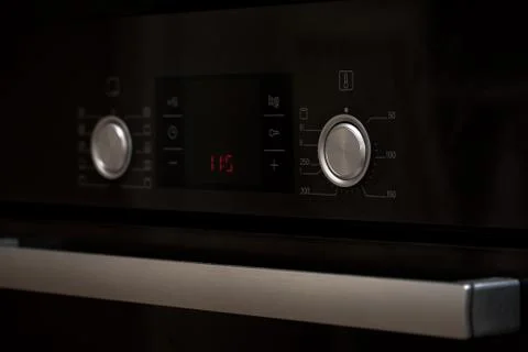 Control knobs and display modern electric stove Stockfoto's