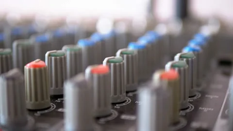 Control knobs on a sound mixing console Stock Footage 100857646
