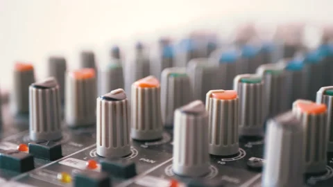Control knobs on a sound mixing console Stock Footage 100877469