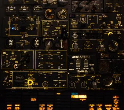 Control levers and switches with backlighting. Airplane cockpit. Stock Photos