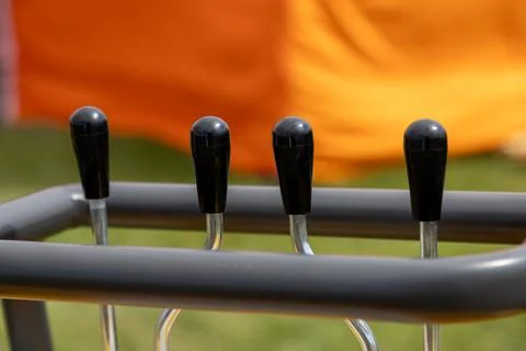 Control levers mounted on metal frame of mechanical device Stock Photos