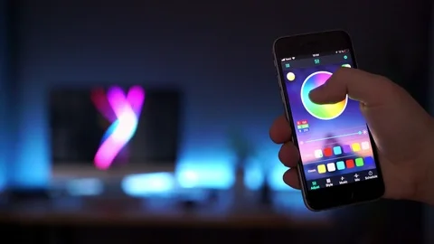 Control the light using your phone through the smart home app. Change the color Stock Footage 121327717