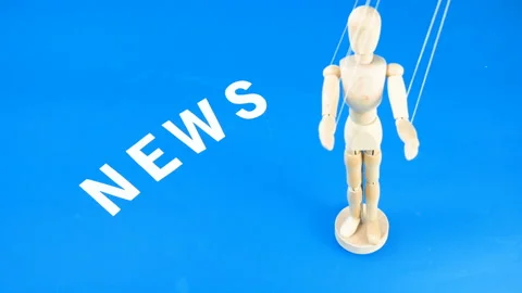 Control a marionette by strings on fingers and word news on blue background,  Stock Footage 139148334