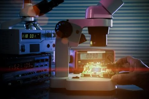 Control microelectronic device in a laboratory microscope Stock Photos