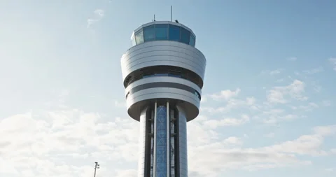 Control navigation building of air traffic,command tower against cloudy sky Stock Footage 336940414