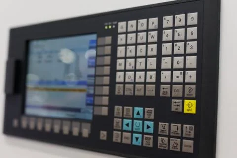 Control panel and screen of CNC-operated machine Stock Photos