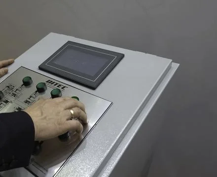 Control panel for asynchronous motors. Operator at work at control panel. Stock Photos