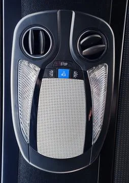 Control panel of a bus with buttons and vents for passenger use Фото