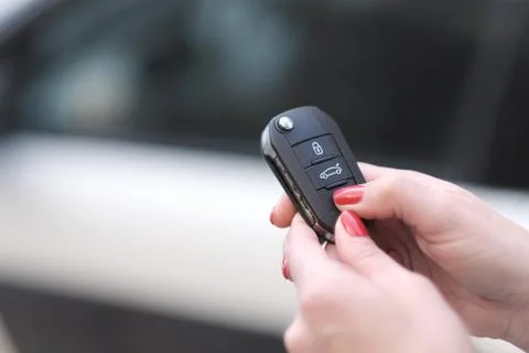 The control panel of the car and its signaling in the hands of a woman Stock Photos