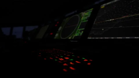 Control panel in dark: keyboard, radar screen, map Stock Footage 236175548
