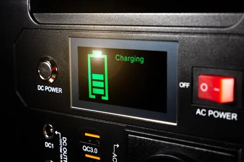 Control panel display of lithium Portable Power Station. Charging laptop sm.. Stock Photos