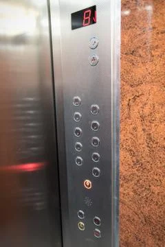 Control panel in elevator going down Stock Photos