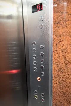 Control panel in elevator going down Stock Photos