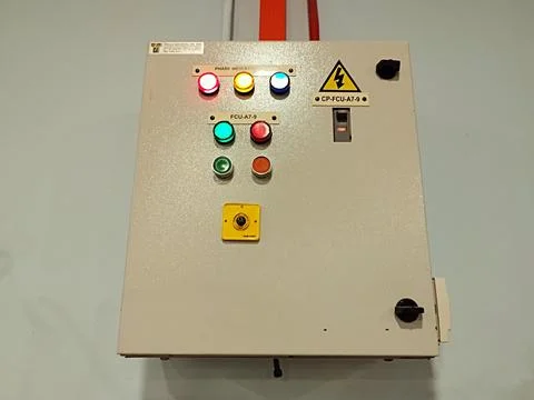 A control panel for a fan coil unit (FCU), likely used in a building HVAC system Stock Photos