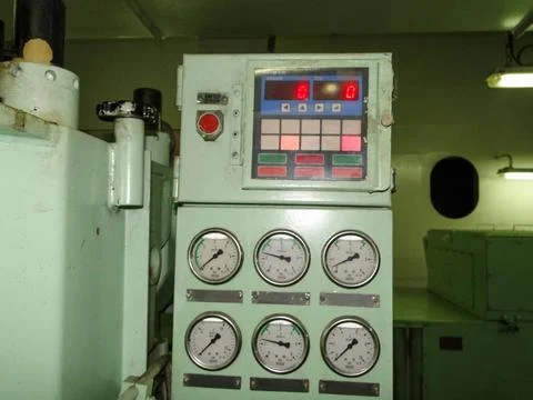 Control Panel with Gauges and Emergency Stop Button in Engine Room Foto stock